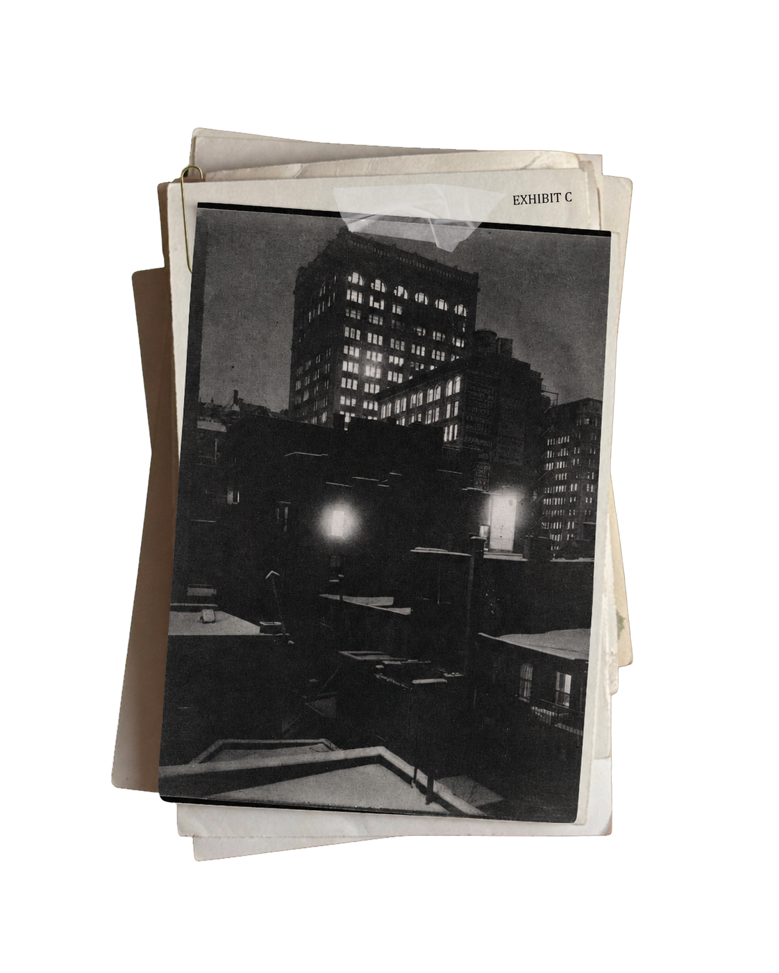 Exhibit C: a stack of archival papers holding a nighttime Manhattan rooftop photograph
